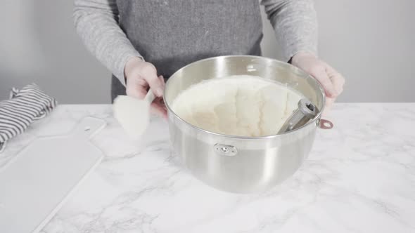 Time lapse. Step by step. Mixing ingredients in a standing kitchen mixer to prepare cream cheese fro