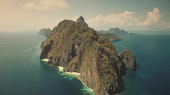 Mountain Islet at Tropic Sea Aerial View