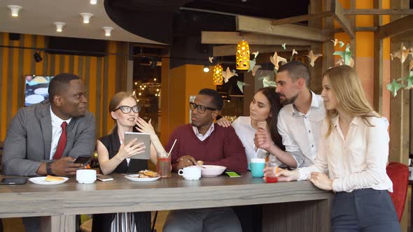 Group of Young Mixed Race People in Coffee Shop.