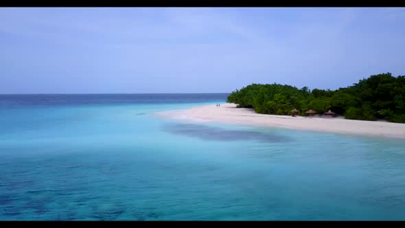 Aerial scenery of beautiful resort beach break by turquoise ocean with white sandy background of a d