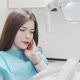Young Woman Suffering From Toothache Sitting in Dental Chair - VideoHive Item for Sale