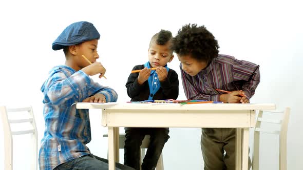 Children Draw at the Table