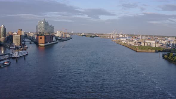 Flying upstream on the River Elbe with the Elbphilharmonie concert hall on the Gasbrook Peninsula an