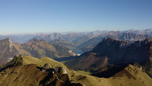 Overflying mountain summits with autumn colors. Rochers de Naye area (Prealps, Switzerland)