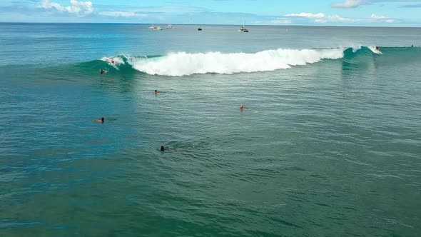 Aerial view of bodysurfer riding a wave at Point Panic in Oahu Hawaii