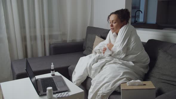 Sick Woman Having Cold Flu Virus Using Telemedicine Service Indoors