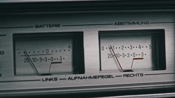 Two Analog VU Meters on Silver Colored Tape Recorder Arrow Indicators