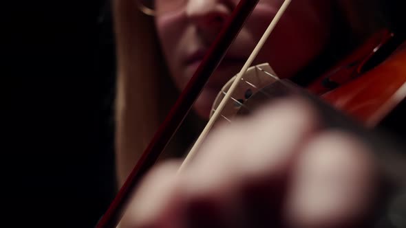 Performer is a Woman Plays the Violin and Does Music View the Closeup