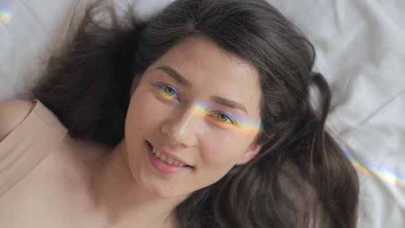 Happy Asian Mixed Race Woman Portrait. Happy Female with a Rainbow Flare on Her Face. Lesbian, Lgbt