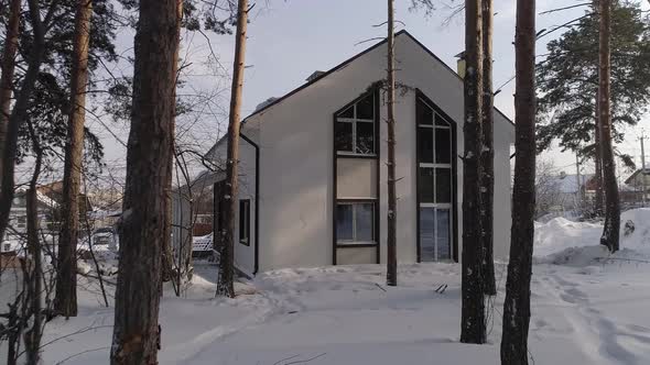 Drone shot of new white modern residential house at winter 03