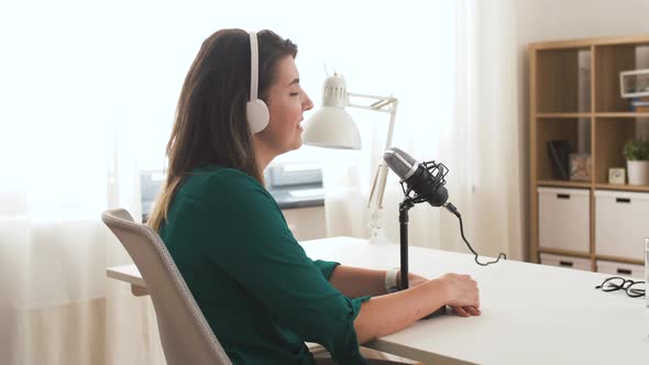 Woman with Microphone Recording Podcast at Studio