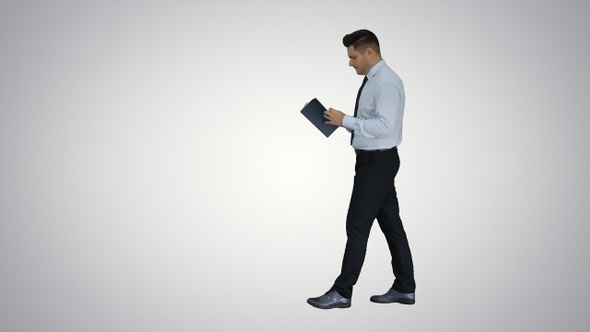 Young confused man trying to read smart book misunderstanding alt