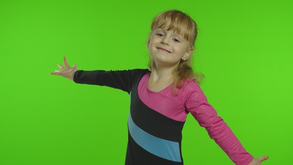 Child Ballerina Exercising in Studio on Chroma Key Background. Girl Kid Dancing, Making Gymnastics