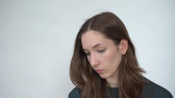 A Young Woman Reading Messages on Her Smartphone