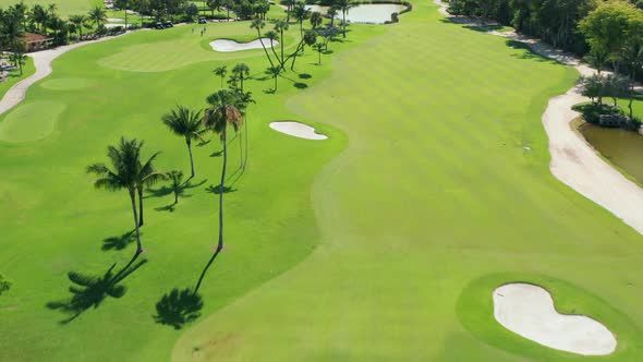 Aerial Footage of People on a Golf Course Playing the Sport Match in Miami, USA