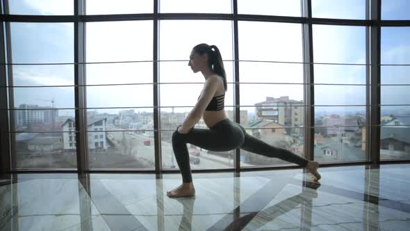 Beautiful yoga woman practice in a training hall . Yoga concept.