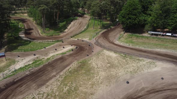 Motorcycles on motocross terrain in the forest in Halle, The Netherlands