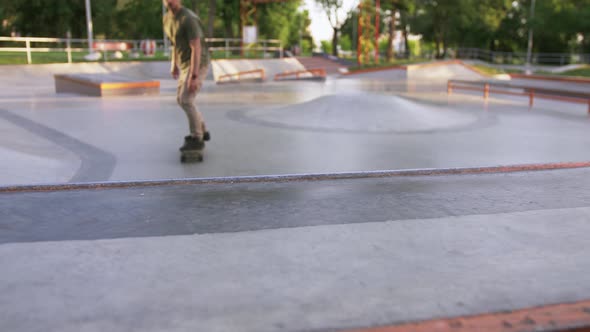 Skateboarder Doing a Tricks in a Concrete Skate Park Close Up Slow Motion