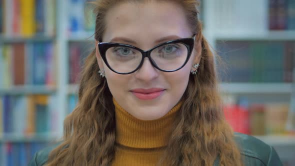 Portrait Close Up of Happy Pretty Young Woman, Girl in Glasses Student Smiling Looking in the Camera