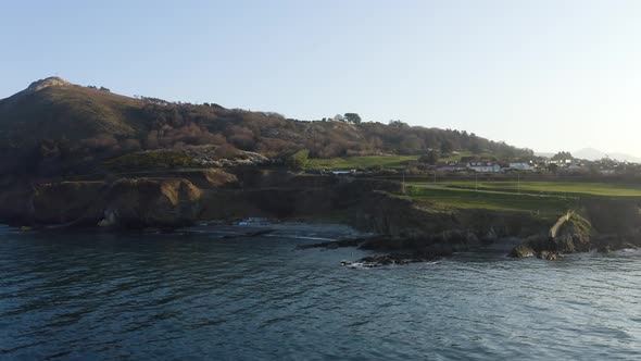 Aerial view of a rocky beach at Bray during a sunny day