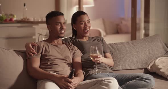 Diverse Couple Watching TV During Date