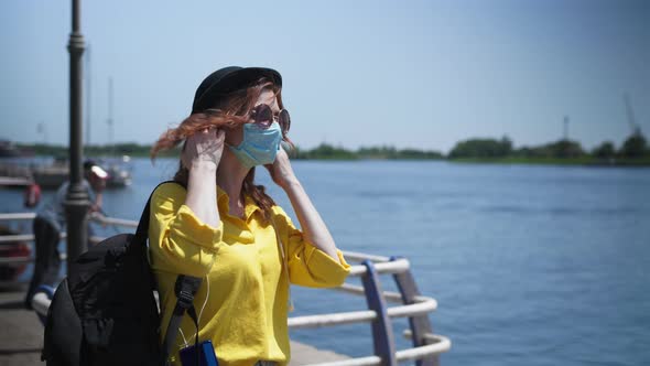 Quarantine Release, Happy Young Woman Cheers After Border Opening and Takes Off Her Medical Mask To