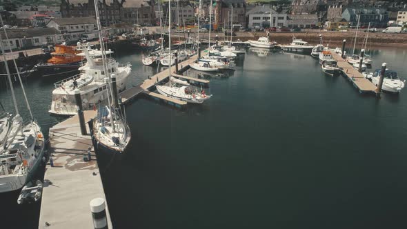 Closeup Harbor Dock with Yachts Aerial alt