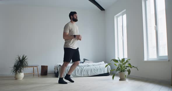 Young Man Doing Forward Lunge Exercises at Home