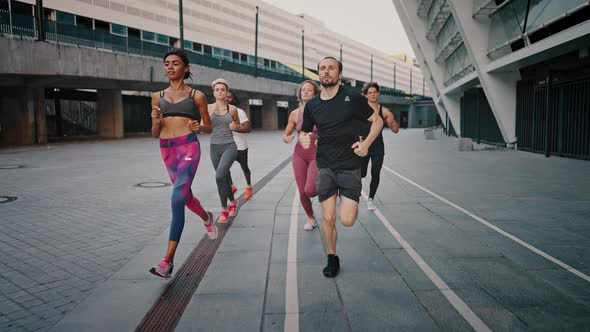 Young People Men and Women Running Together Sports Activity