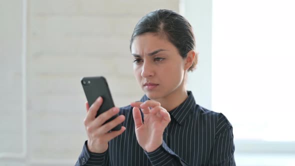 Young Indian Woman Having Loss on Smartphone 