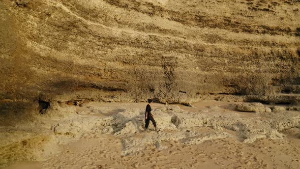 Drone Flight Along Girl Walking on the Beach Bali Indonesia