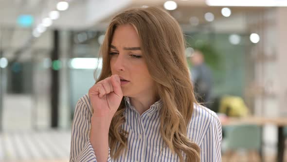 Portrait of Sick Businesswoman Coughing