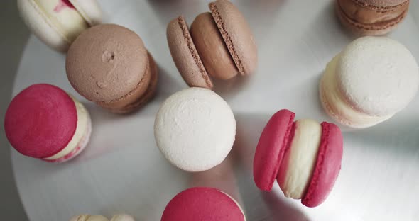 Close Up of Colorful White Red and Caramel Chocolate Macarons Dessert Filling