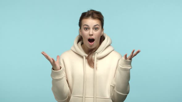 Slow Motion of Surprised and Happy Blonde Woman Receive Great News Looking with Disbelief Showing