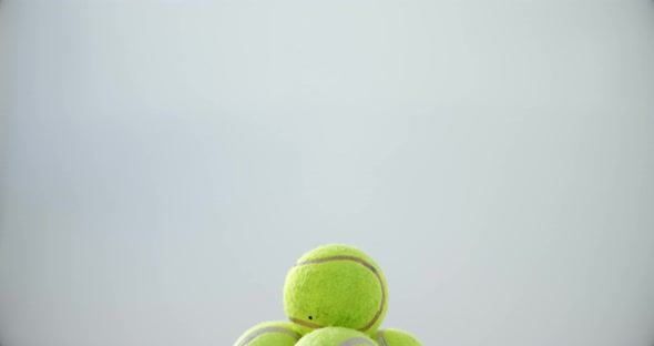 Stack of tennis balls on white background 4k