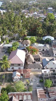 Zanzibar Tanzania  Aerial View of Houses Near the Coast Vertical Video