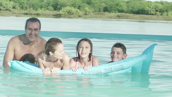 Family together on float in water