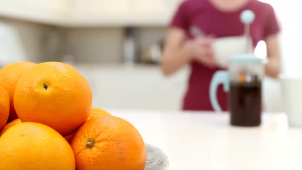 Woman making coffee in kitchen 4k