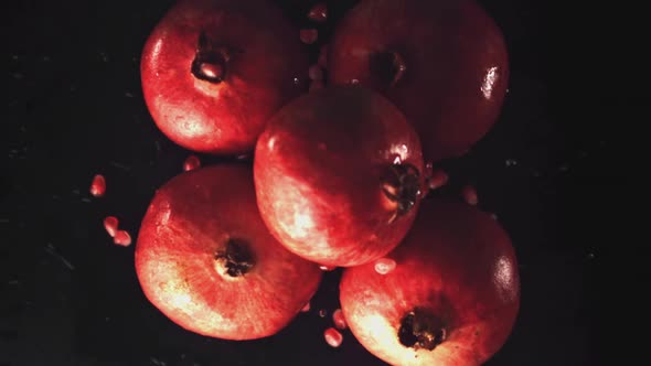 Super Slow Motion Whole Ripe Pomegranates Rise Up