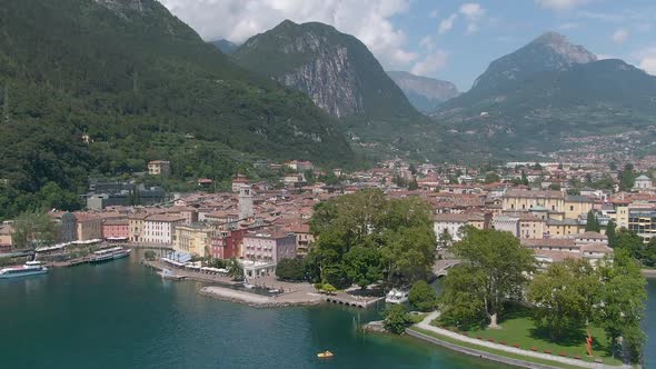 Beautiful drone view of the north italian city Riva Del Garda with the lake garda in the foreground