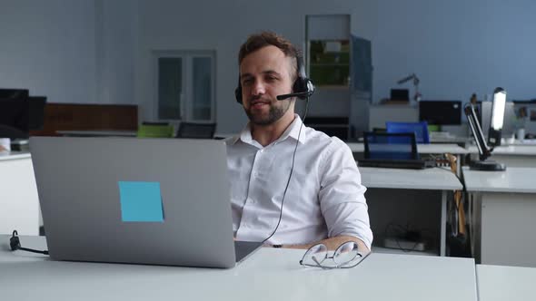 Handsome Young Office Worker Does His Online Work