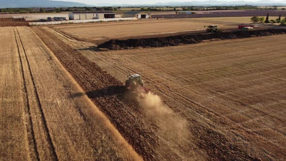 Combine harvester harvesting wheat grain in agriculture cereal farming field