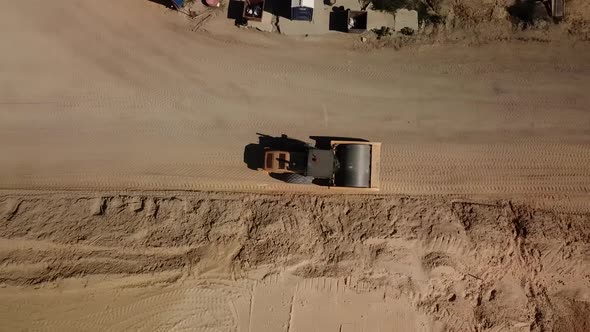 Top Down View of the Roller Is Rolling Sand During the Construction of the Road