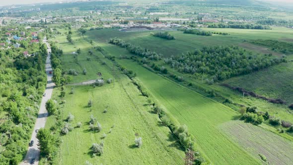 Beautiful Rural Landscape with Road, Cars and Trees