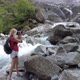 Woman Photographer at Foroglio Waterfall - VideoHive Item for Sale
