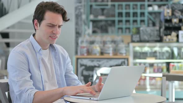 Creative Man with Laptop Feeling Angry