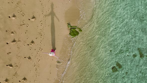 Alone Woman Walking By Beautiful Hawaii Beach Travel Destination for Tourists