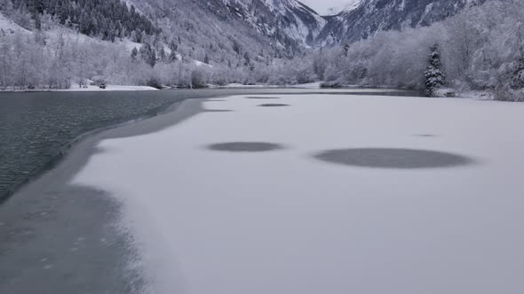 Drone Tracking Shot of Partially Frozen Lake in Klammsee Austria