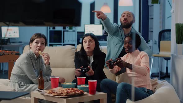 Diverse Group of People Playing Video Games on Tv Console