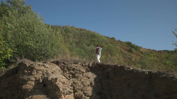 Young Active Woman Climbing with Backpack at Bakota Area